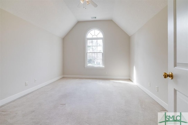 bonus room featuring light carpet, baseboards, visible vents, lofted ceiling, and ceiling fan