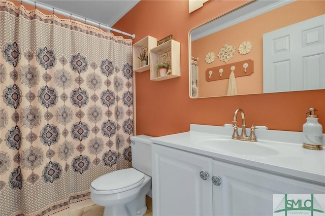 bathroom featuring toilet, vanity, ornamental molding, and a shower with shower curtain