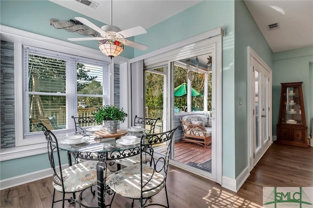 sunroom / solarium featuring ceiling fan