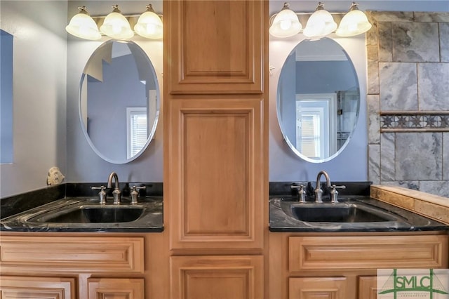 bathroom with crown molding and vanity