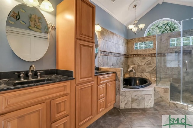 bathroom with an inviting chandelier, tile patterned flooring, lofted ceiling, shower with separate bathtub, and vanity