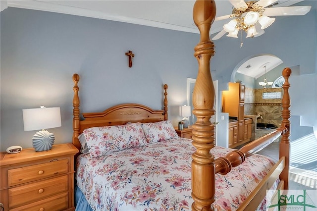 bedroom with crown molding, vaulted ceiling, and ceiling fan with notable chandelier