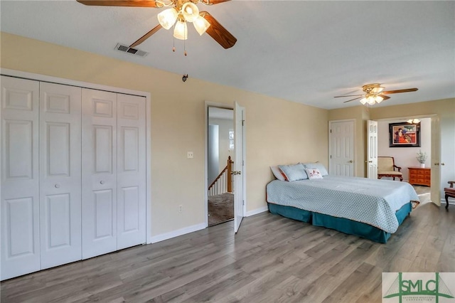 bedroom with ceiling fan and light hardwood / wood-style flooring