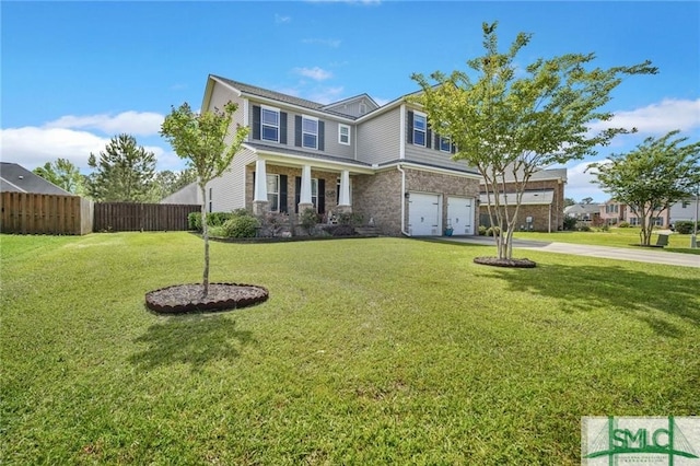 view of front of home featuring an attached garage, fence, a front lawn, and concrete driveway