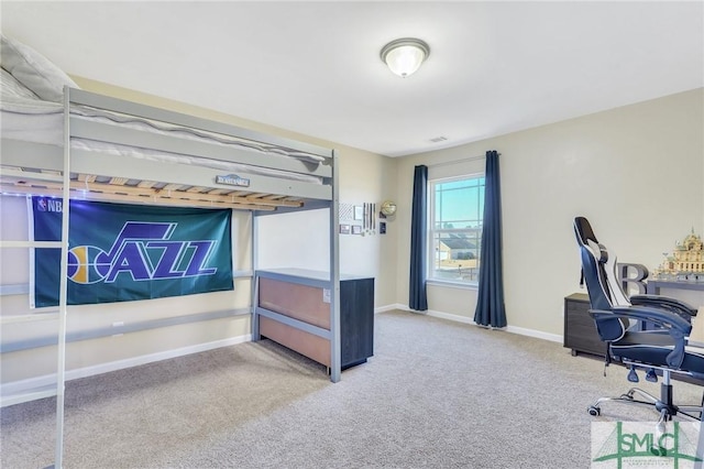 bedroom with carpet and baseboards