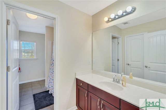 bathroom with tile patterned flooring and vanity