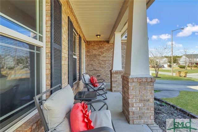 view of patio featuring a porch