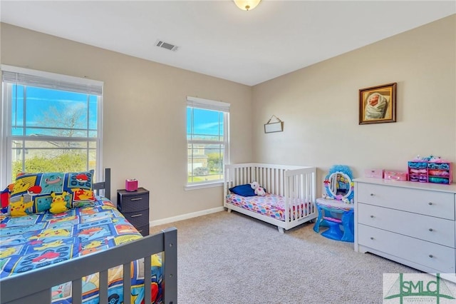 bedroom with carpet, visible vents, and baseboards