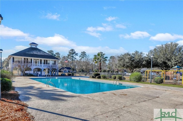 view of swimming pool with a patio area