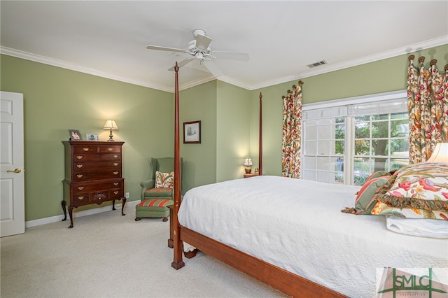 bedroom with ceiling fan, carpet, and crown molding