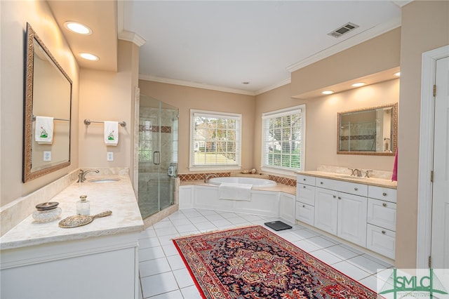 bathroom with vanity, crown molding, independent shower and bath, and tile patterned flooring