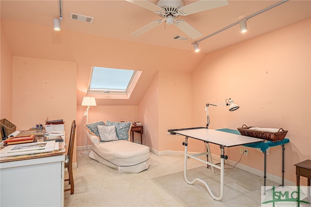 carpeted office featuring ceiling fan, lofted ceiling, and track lighting