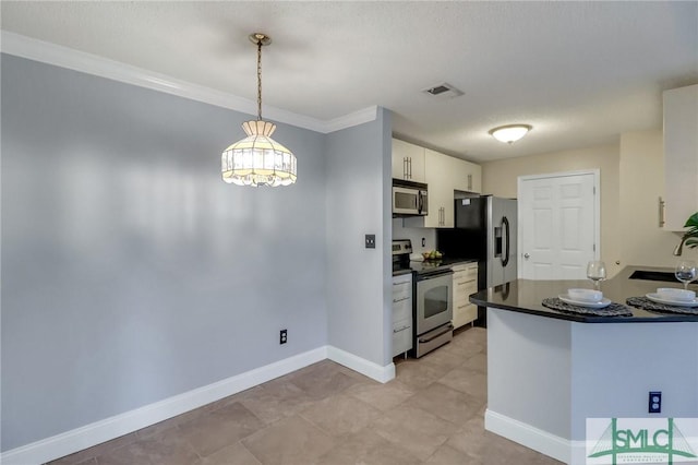 kitchen with white cabinets, appliances with stainless steel finishes, decorative light fixtures, sink, and crown molding