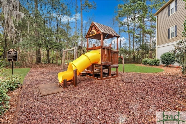 view of playground featuring a lawn