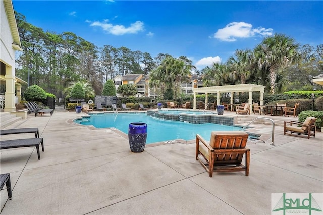 view of swimming pool with a patio and a pergola