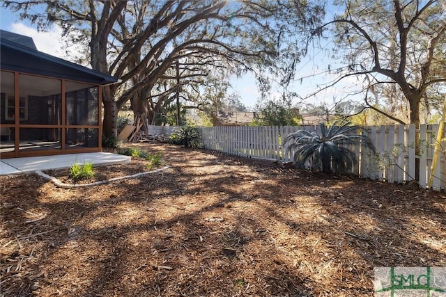 view of yard featuring a patio area and a sunroom