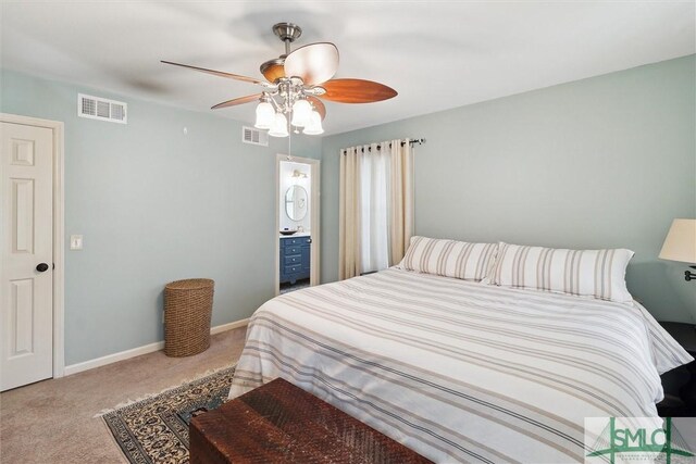 bedroom featuring ceiling fan, carpet, and ensuite bathroom