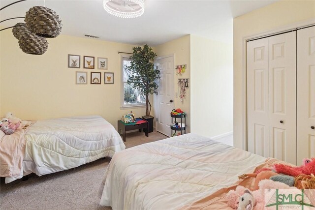 bedroom with light colored carpet