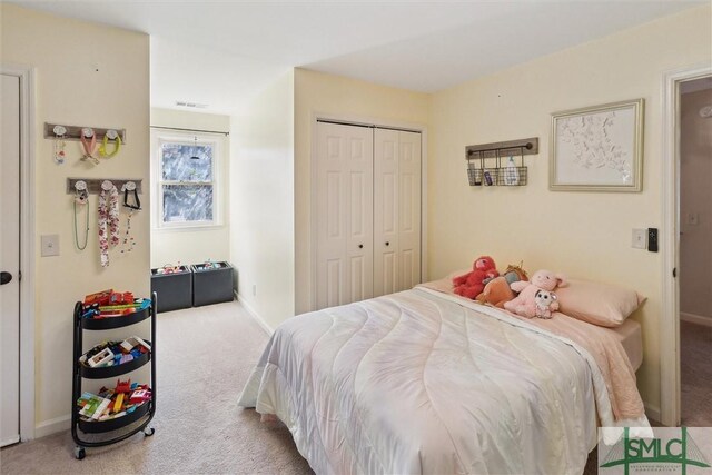 carpeted bedroom featuring a closet