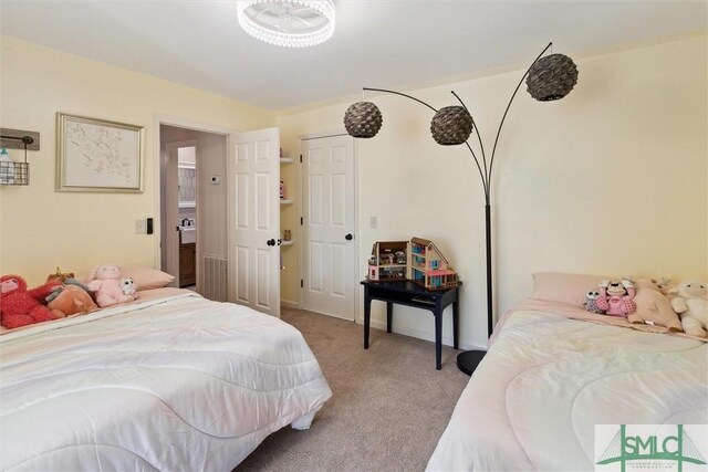 bedroom featuring light colored carpet