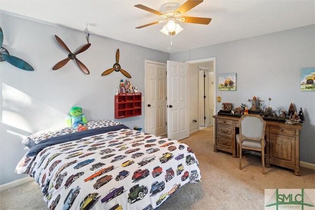 carpeted bedroom featuring ceiling fan