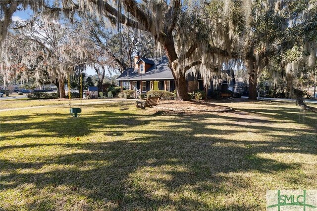 exterior space with a front yard