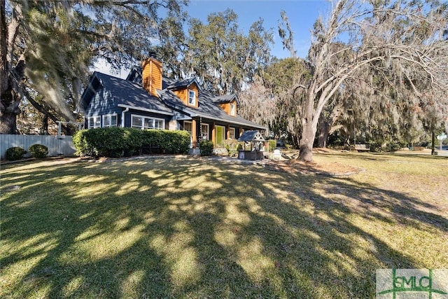 new england style home with a front lawn