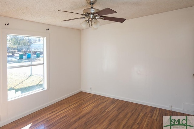 empty room with ceiling fan, a textured ceiling, and dark hardwood / wood-style flooring