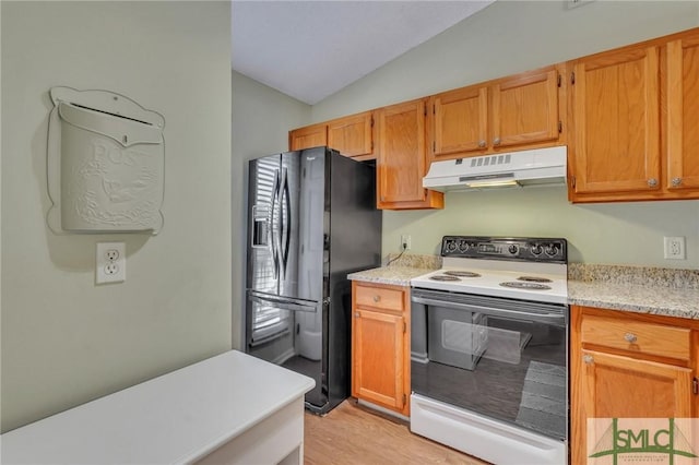 kitchen with light hardwood / wood-style floors, electric range, black fridge, and vaulted ceiling