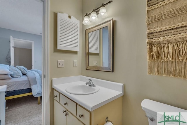 bathroom with toilet and vanity