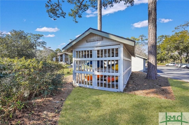 rear view of house with a yard