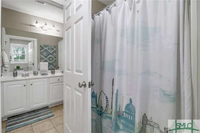 bathroom with vanity, a shower with shower curtain, and tile patterned flooring