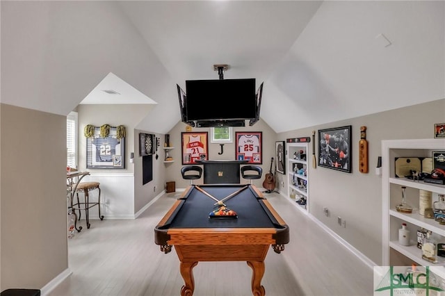 rec room with vaulted ceiling, built in shelves, light hardwood / wood-style flooring, and billiards