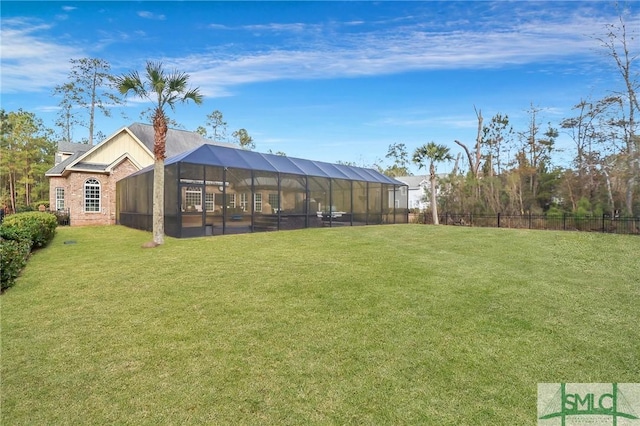 view of yard with glass enclosure