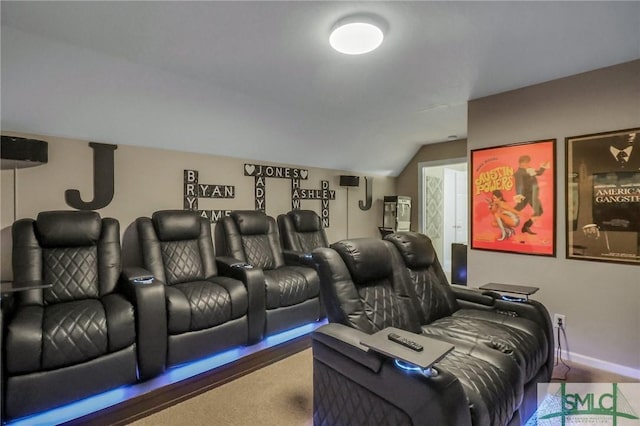 home theater room with carpet floors and lofted ceiling