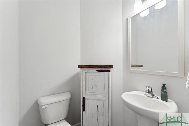 bathroom with sink and toilet