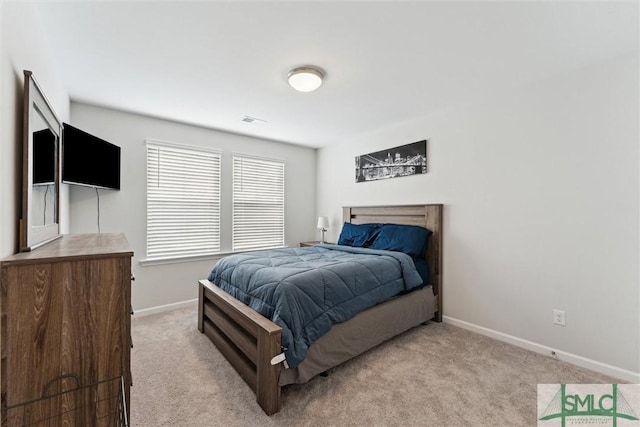 bedroom with light carpet