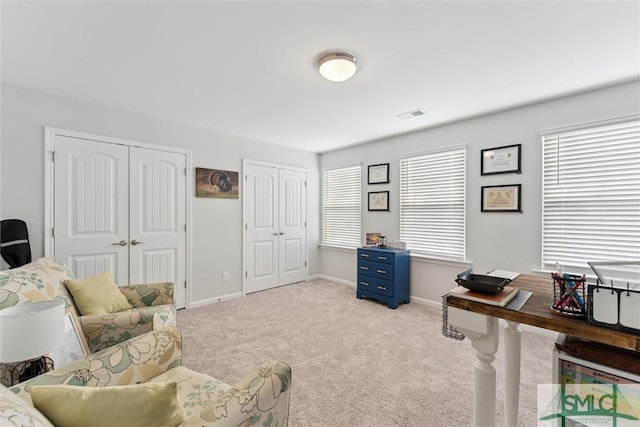 home office featuring light carpet