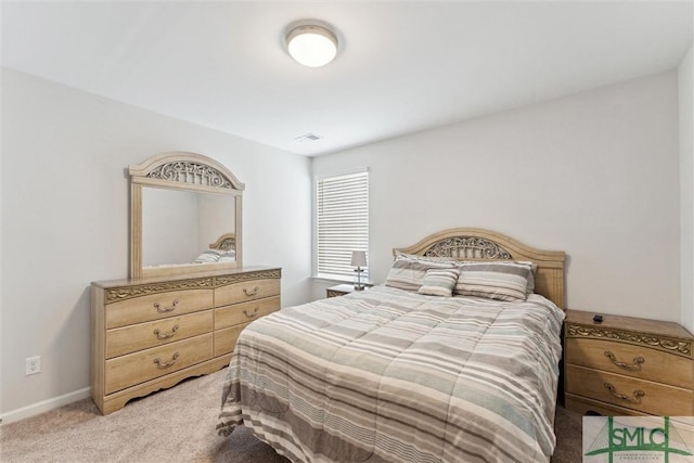 bedroom with light carpet