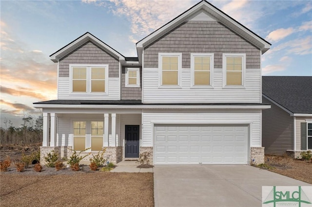 craftsman house featuring a garage