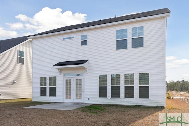 back of house with a patio