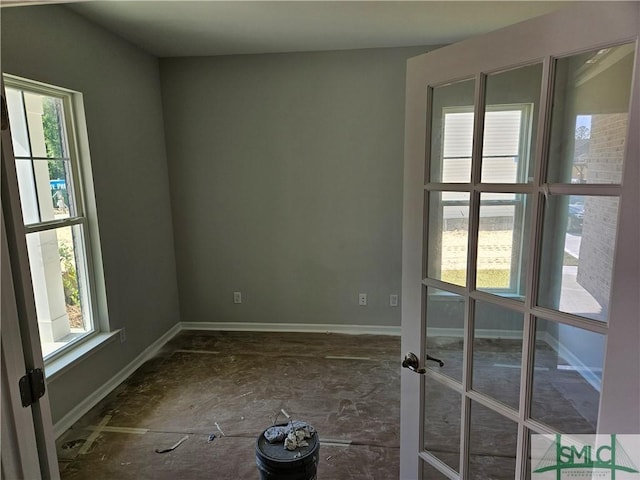 empty room featuring baseboards