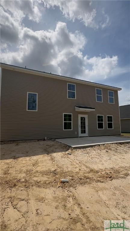 rear view of property with a patio area