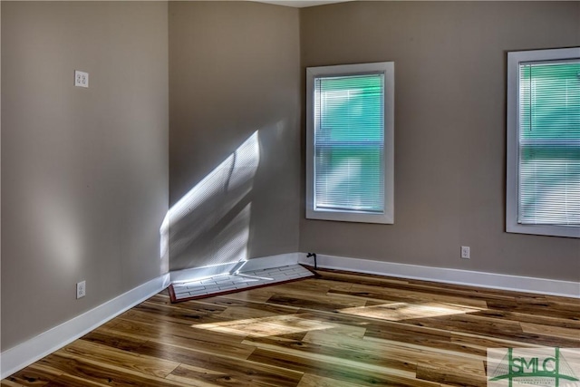 spare room featuring hardwood / wood-style floors