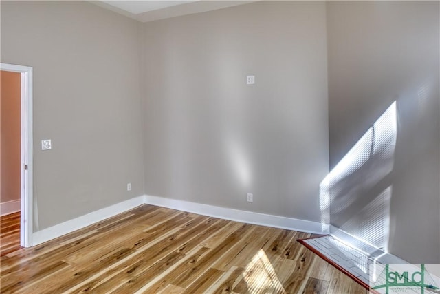 spare room featuring light hardwood / wood-style flooring