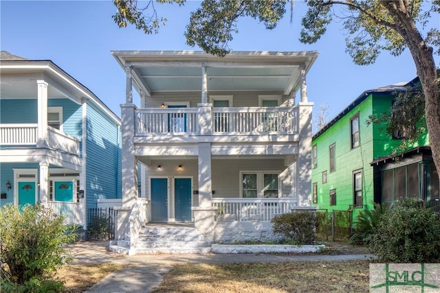 view of front facade with a porch and a balcony