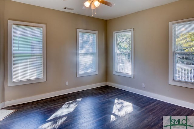 empty room featuring ceiling fan and dark hardwood / wood-style floors