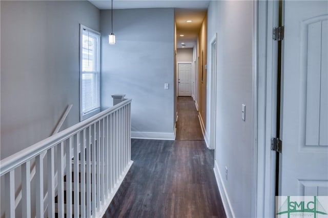 hallway with dark hardwood / wood-style floors