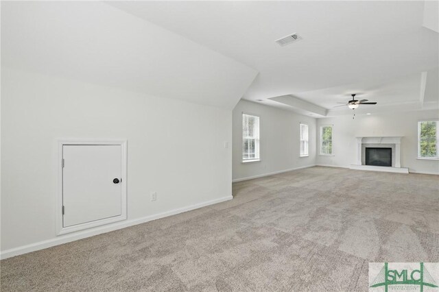 106 Liam Ct, Guyton, GA 31312 - unfurnished living room with carpet flooring, healthy amount of natural light, a ceiling fan, and baseboards