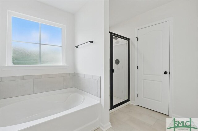 106 Liam Ct, Guyton, GA 31312 - full bath with a bath, a shower stall, and baseboards